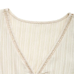 Beige klänning med volang