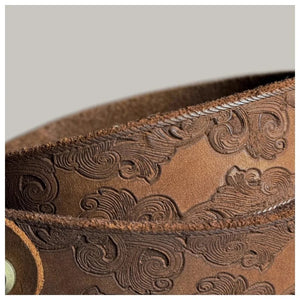 Präglat cowboybälte i äkta läder med mässingsspänne