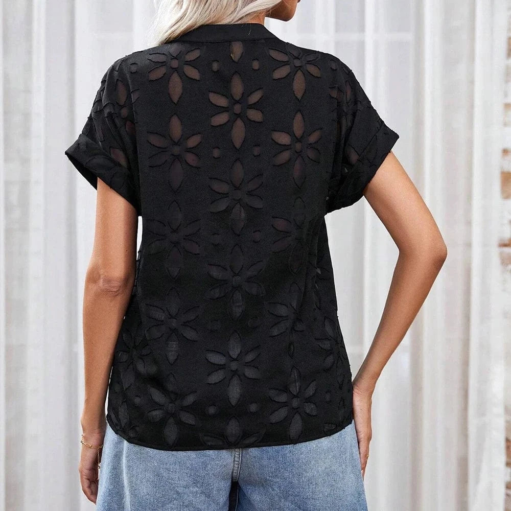 Blus med blommigt hålmönster