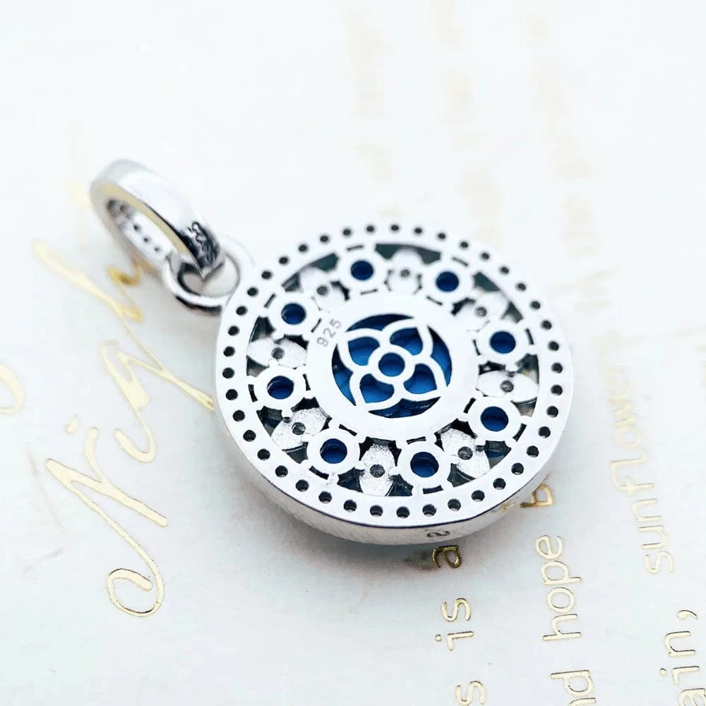 Rund silverberlock med turkos och strass Silver med turkos